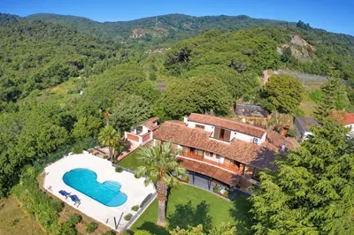 an aerial view of a house with a swimming pool at PREMIUM HABITAT Can Ferrer in Arenys de Munt