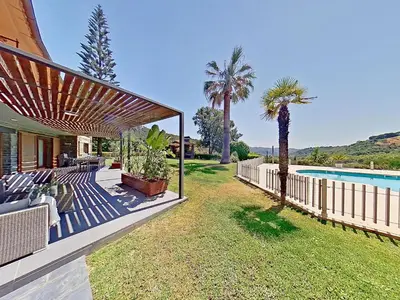a house with a patio and a swimming pool at PREMIUM HABITAT Can Ferrer in Arenys de Munt
