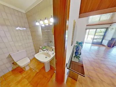 a bathroom with a sink and a toilet and a mirror at PREMIUM HABITAT Can Ferrer in Arenys de Munt