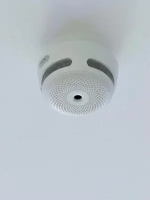 a white ceiling with a speaker in a room at Attic Center Sitges in Sitges