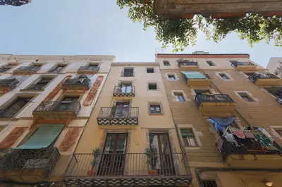 a tall building with balconies on the side of it at En Ville Boutique Apartments Boqueria Market in Barcelona