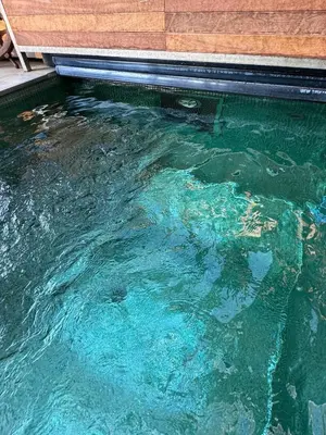 a pool of clear blue water in a swimming pool at Suite with Pool Barcelona in Vilassar de Dalt