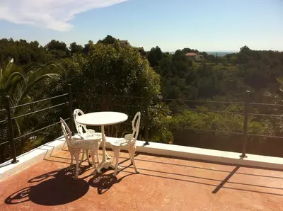 a large swimming pool in front of a house at Independ room in villa with views 2 in Castelldefels