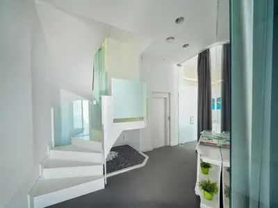 a white staircase in a room with a mirror at Villa in Sitges with Pool, Jacuzzi, BBQ, View, AC, 12Pax in Sitges