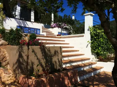 a set of stairs in front of a building at Suite in private villa view on sea in Castelldefels