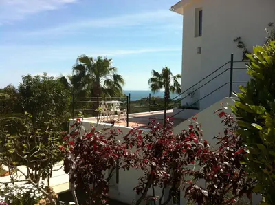 a view from the balcony of a house at Suite in private villa view on sea in Castelldefels