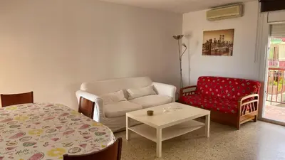 a living room with a couch and a table at Maresme in Canet de Mar