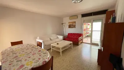 a room with a bed and a couch and a chair at Maresme in Canet de Mar