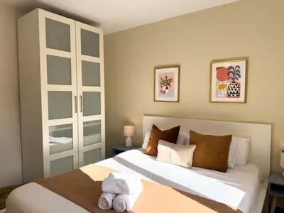 a bedroom with a large bed with towels on it at Boutique Remei in Barcelona