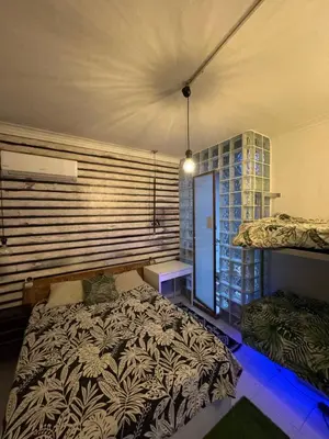 a bedroom with a bed in a room with a window at stressless house in Barcelona