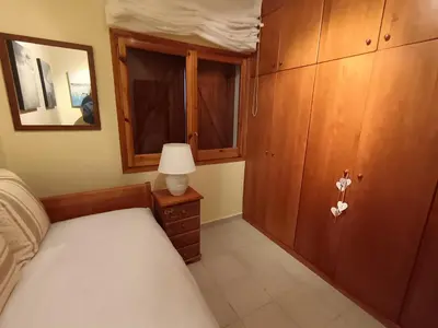 a bedroom with a bed and a cabinet with a mirror at El Mirador de Can Barri BB Vistas Piscina y Desayuno Gourmet in Bigues i Riells