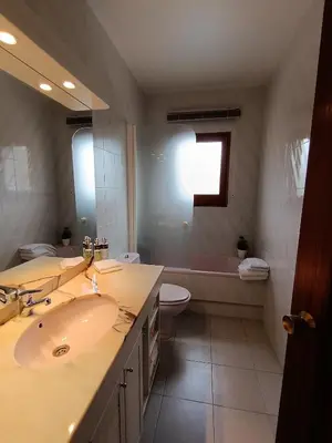 a bathroom with a sink and a toilet and a tub at El Mirador de Can Barri BB Vistas Piscina y Desayuno Gourmet in Bigues i Riells