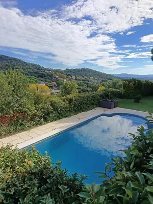 a swimming pool with a view of the mountains at El Mirador de Can Barri BB Vistas Piscina y Desayuno Gourmet in Bigues i Riells