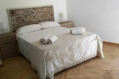 a bedroom with a bed with two towels on it at Casa de pueblo con encanto in Arbós