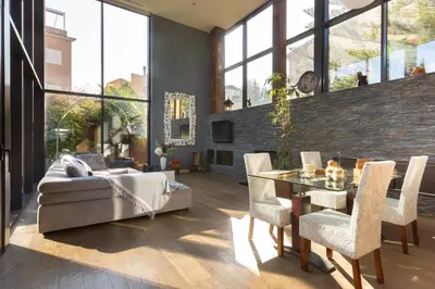 a living room with a couch and a table and chairs at Espai Oliveres Barcelona Villa con piscina in Papiol