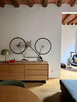 a bike on a dresser in a living room at Spacious and cozy apartment in Barcelona