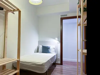 a bedroom with a bed and a bunk bed at Apt Matisse in Vilanova i la Geltrú