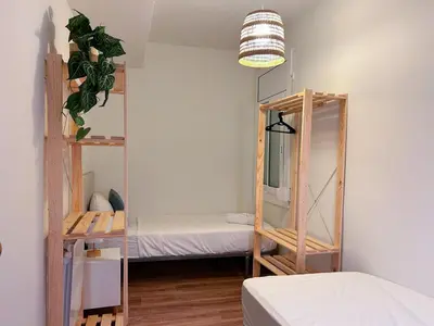 a bedroom with a bunk bed and a mirror at Apt Matisse in Vilanova i la Geltrú