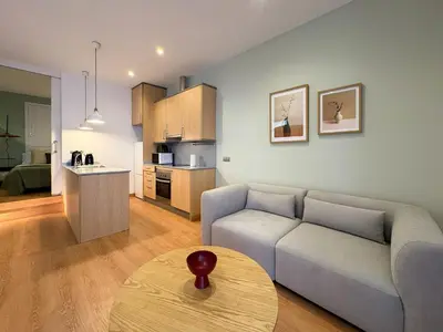 a living room with a couch and a table at Stay Unique Sarrià–Sant Gervasi terraza privada in Barcelona