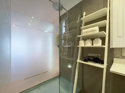 a shower with a glass door in a bathroom at Stay Unique Sarrià–Sant Gervasi terraza privada in Barcelona