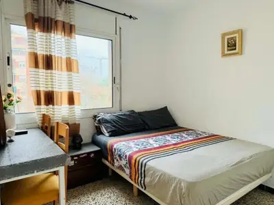 a bedroom with a bed and a window at Barcelona stay in Hospitalet de Llobregat