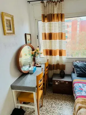 a bedroom with a table and a mirror and a bed at Barcelona stay in Hospitalet de Llobregat