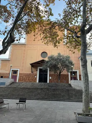 a bench sitting in front of a building with stairs at Apartamentos Barcelona - Iberia in Barcelona