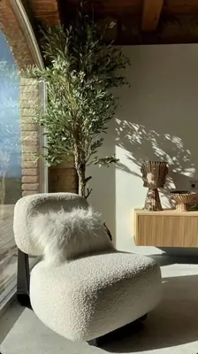 a white chair with a tree in a room at Villa Mas Summit in Collsuspina