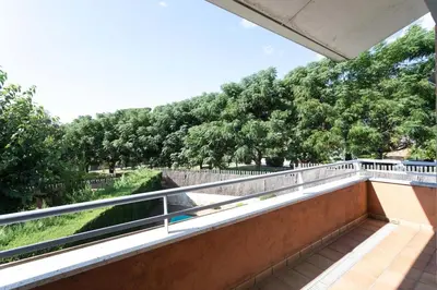 a balcony with a view of trees at TARRACO - Private Pool Villa in Arenys de Munt in Arenys de Munt
