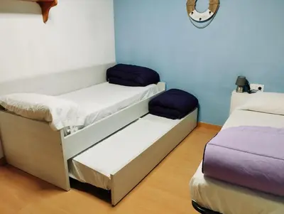 two bunk beds in a room with a mirror at Apart 1º & Spa and Parking in Calella, Barcelona in Calella