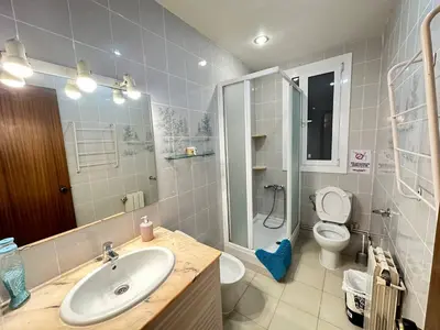 a bathroom with a sink and a toilet at Rooms Consell de Cent in Barcelona