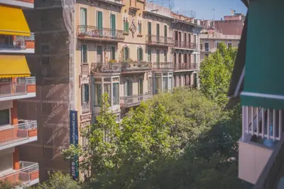 an apartment building with balconies on the side of it at You Stylish Eixample Apartments in Barcelona