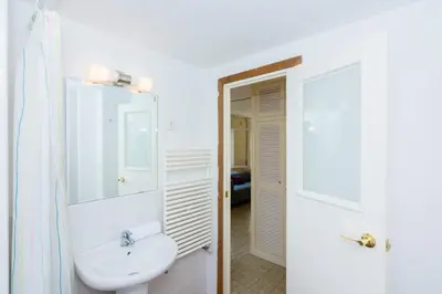 a large building with a swimming pool in front of it at HomeHolidaysRentals Olimpia - Costa Barcelona in Pineda de Mar
