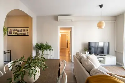 a living room with a couch and a table at Eixample Barcelona Luxury for 8 in Barcelona