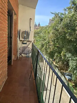 a living room with a couch and a table at little 3 bedrooms apartement barcelona center in Barcelona