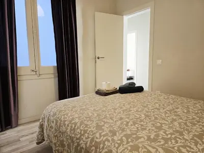 a kitchen with white appliances and a trash can at little 3 bedrooms apartement barcelona center in Barcelona