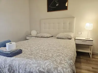 a living room with a table and a couch at little 3 bedrooms apartement barcelona center in Barcelona