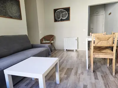 a bathroom with a white toilet and a sink at little 3 bedrooms apartement barcelona center in Barcelona