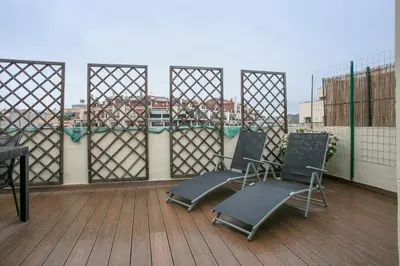 two chairs sitting on top of a roof at Alcam Entenza in Barcelona