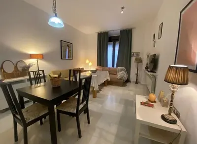 a living room with a table and a dining room at Cristina in Arenys de Mar