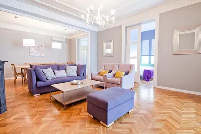 a living room with a couch and chairs and a table at Bcncaliu in Barcelona