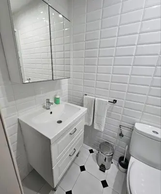 a white bathroom with a sink and a toilet at Five Room Family Flat Near Ramblas in Barcelona