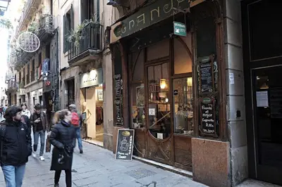 a group of people walking down a street at Five Room Family Flat Near Ramblas in Barcelona
