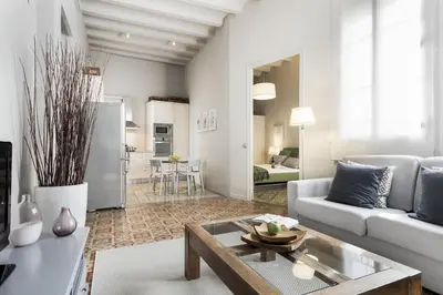 a living room with a couch and a table at Ola Living Gaudi in Barcelona