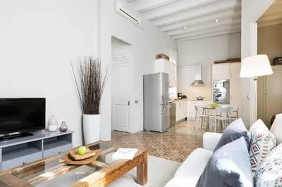 a living room with a couch and a table at Ola Living Gaudi in Barcelona