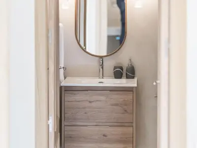a bathroom with a sink and a mirror at 'The Residences At Bartomeu 26 ' Suite Benazet in Sitges