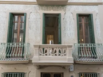 a building with balconies on the side of it at 'The Residences At Bartomeu 26 ' Suite Benazet in Sitges