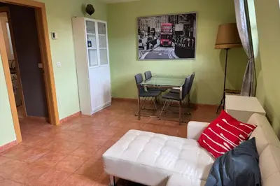 a living room with a white couch and a table at NEW! Apartment for 4 people near the beach in Poblenou in Barcelona
