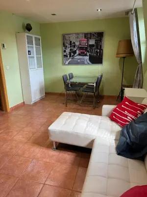 a living room with a white couch and a table at NEW! Apartment for 4 people near the beach in Poblenou in Barcelona