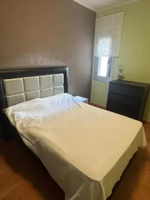 a bedroom with a large bed with a white bedspread at NEW! Apartment for 4 people near the beach in Poblenou in Barcelona